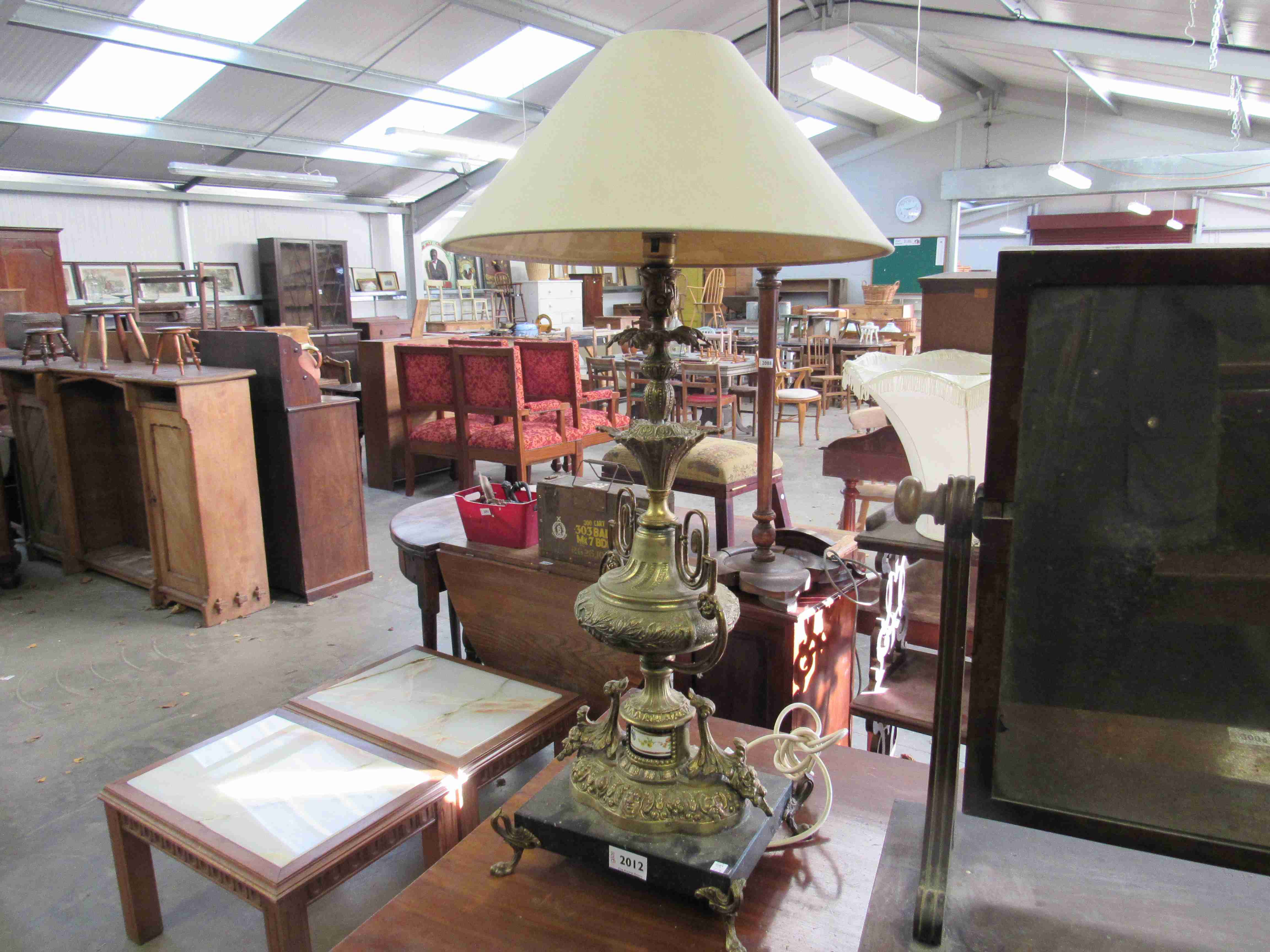 A gilt metal lamp with marble base