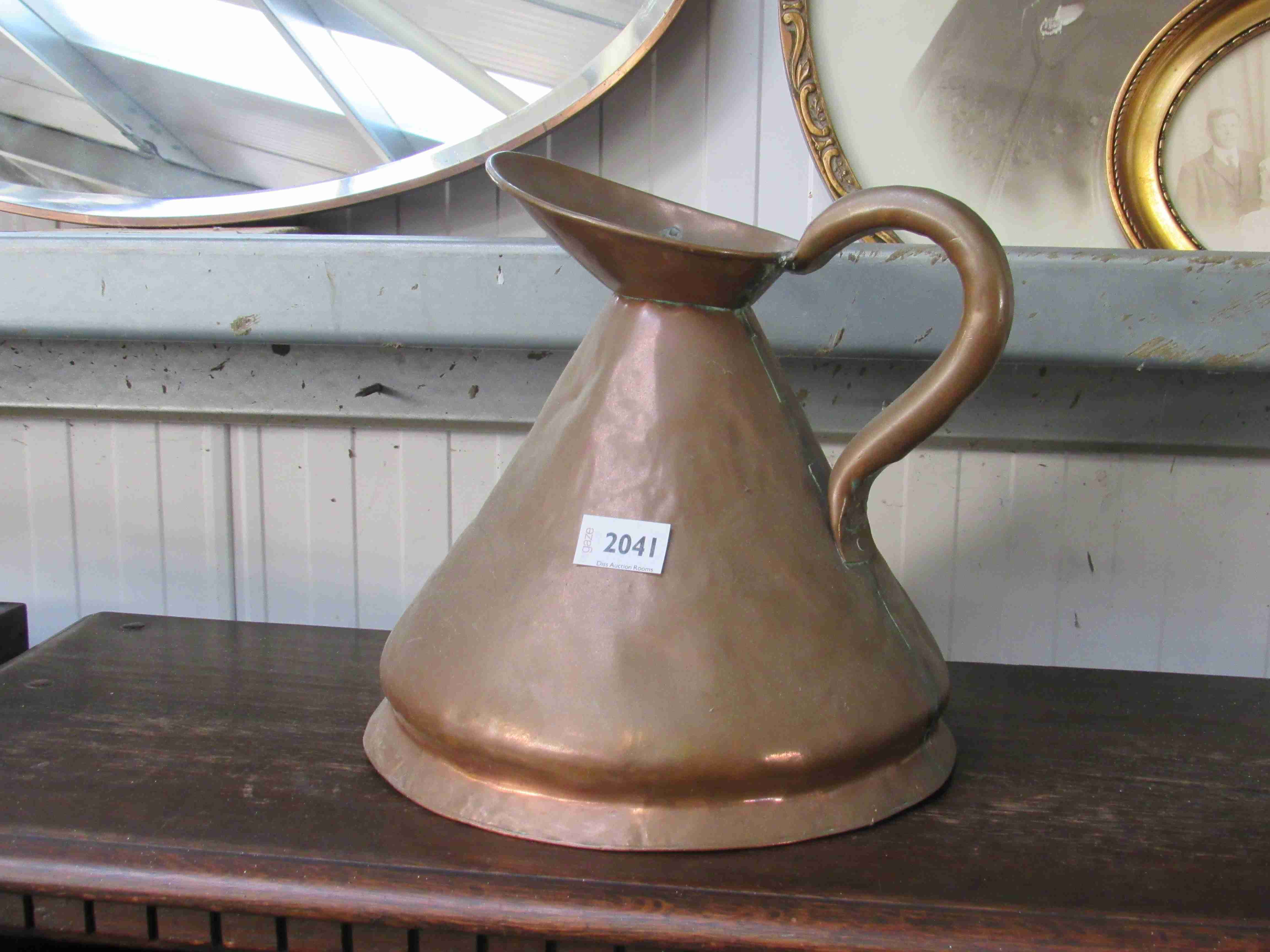 A Victorian copper beer jug