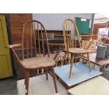 Two light Ercol elm stick back Windsor chairs,