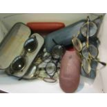 A quantity of vintage spectacles and cases