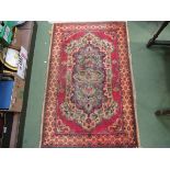 A machine woven wool rug,