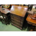 A "Titchmarsh & Goodwin" carved oak and elm writing bureau,