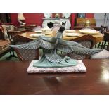 A French Art Deco style spelter sculpture of bird on wave, on marble base,