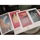 A folder of six reproduction Art Deco posters and a print of Berlin buildings