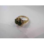 A jade two stone ring with yellow metal shank. Size O, 4.