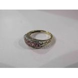 An 18ct pink sapphire and diamond half hoop ring.