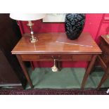 A George III mahogany folding tea table with small frieze, on rectangular section legs,