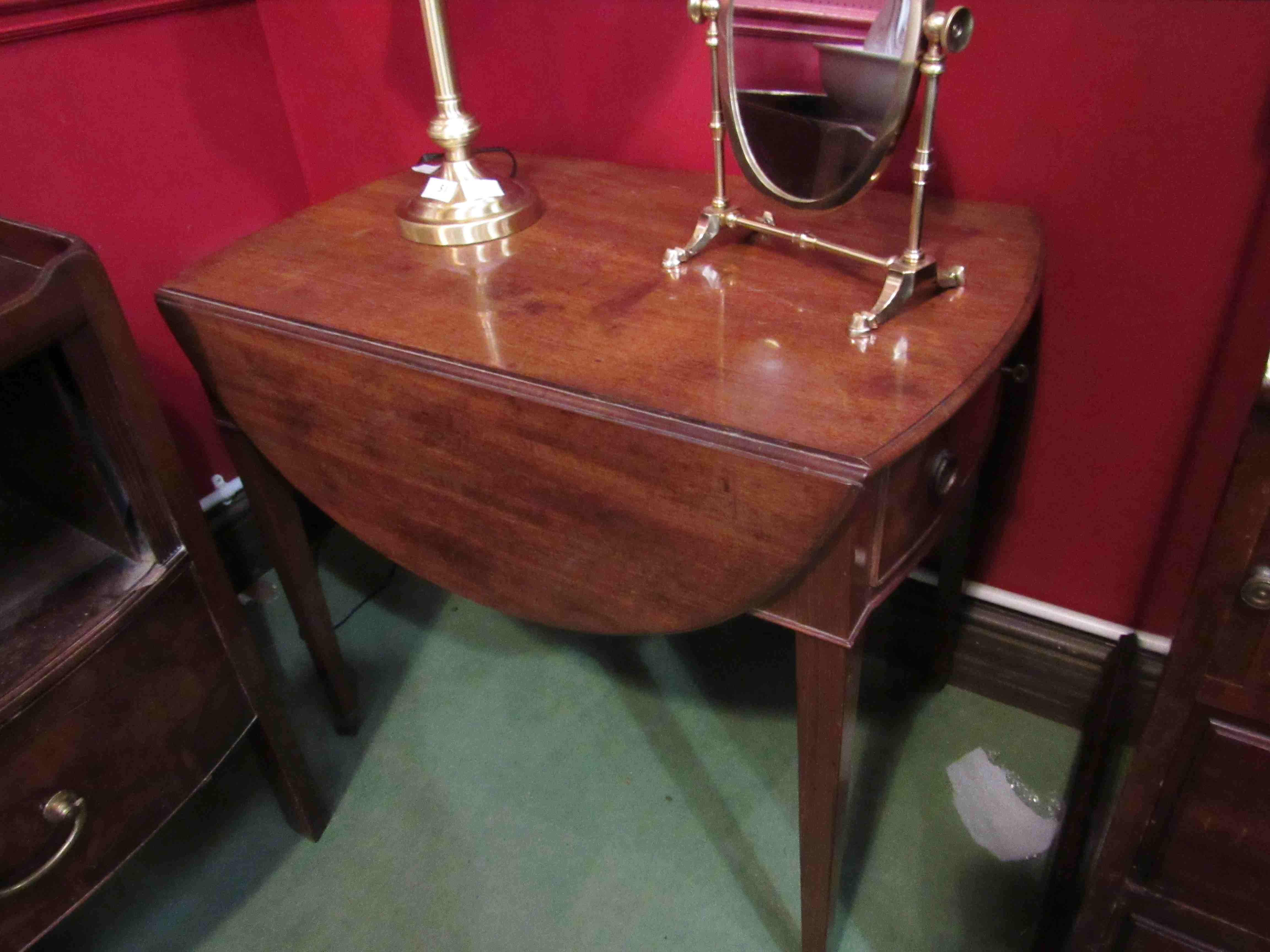 A 19th Century mahogany Pembroke table with single frieze drawer,