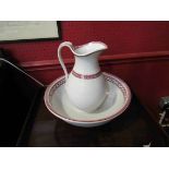 A Victorian red and white patterned wash jug and bowl