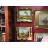 A pair of gilt framed oils on board depicting landscape scenes, signed D.