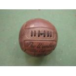 A reproduction Wembley leather football