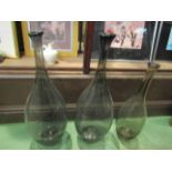 Three smoky grey glass bottles