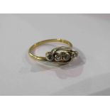 An 18ct gold five stone diamond crossover ring. Size N, 3.