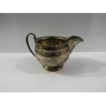 A silver jug,