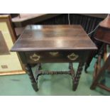 A Georgian style oak side table with single frieze drawer, bobbin-turned supports,