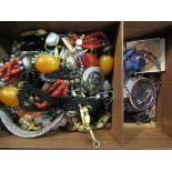 A grape and vine carved wooden box with bijouterie contents including necklaces,