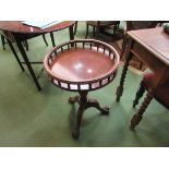 A mahogany circular galleried tripod table,
