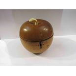 A 19th Century fruitwood apple form tea caddy, 12.5cm tall approx.