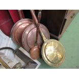 Five copper bed warming pans