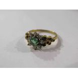 An 18ct emerald and diamond cluster ring.
