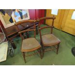 A pair of Edwardian bar-back bedroom chairs with faux bamboo carved legs and stretchers
