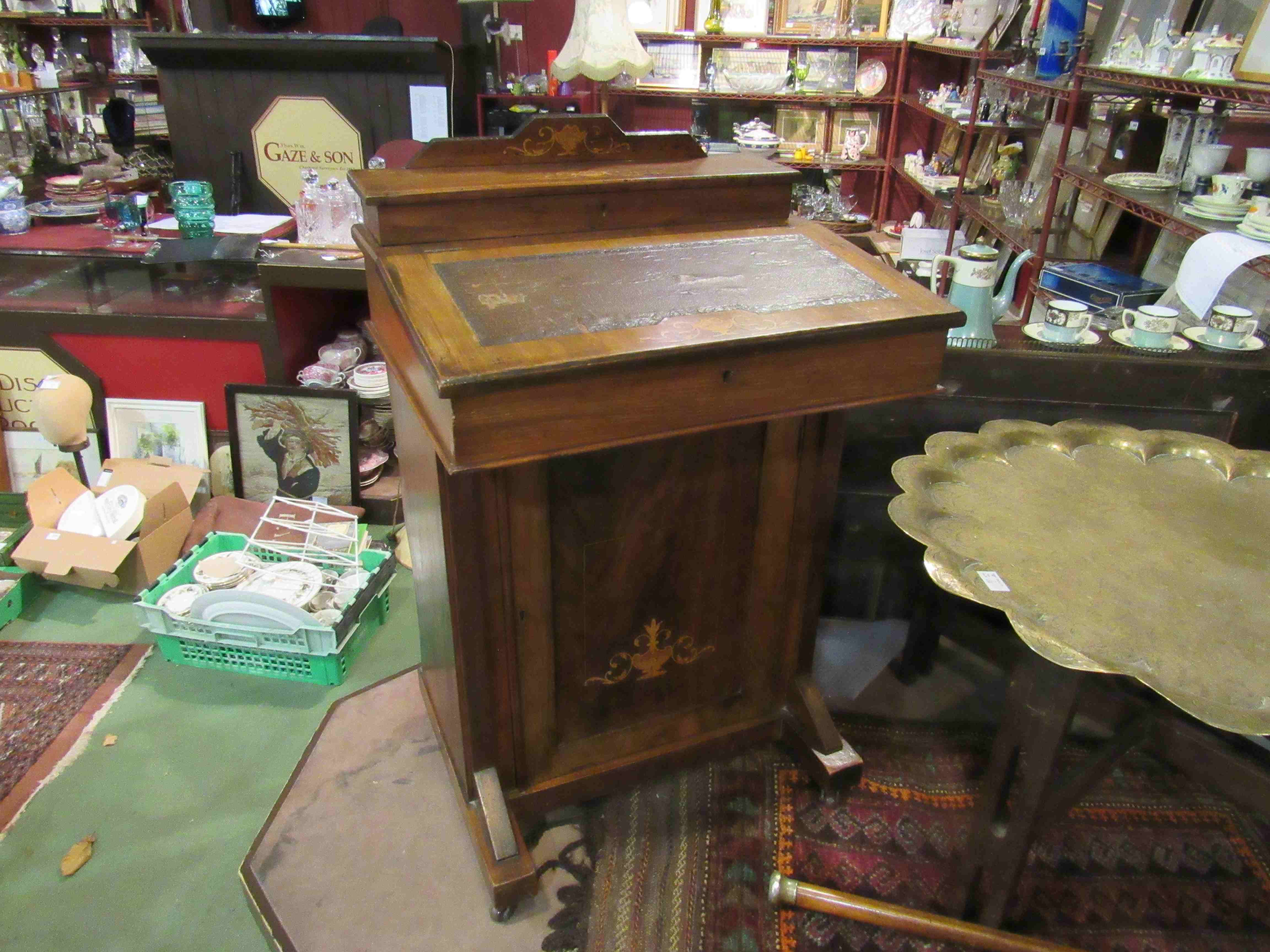 An Edwardian Davenport with cupboard to base,