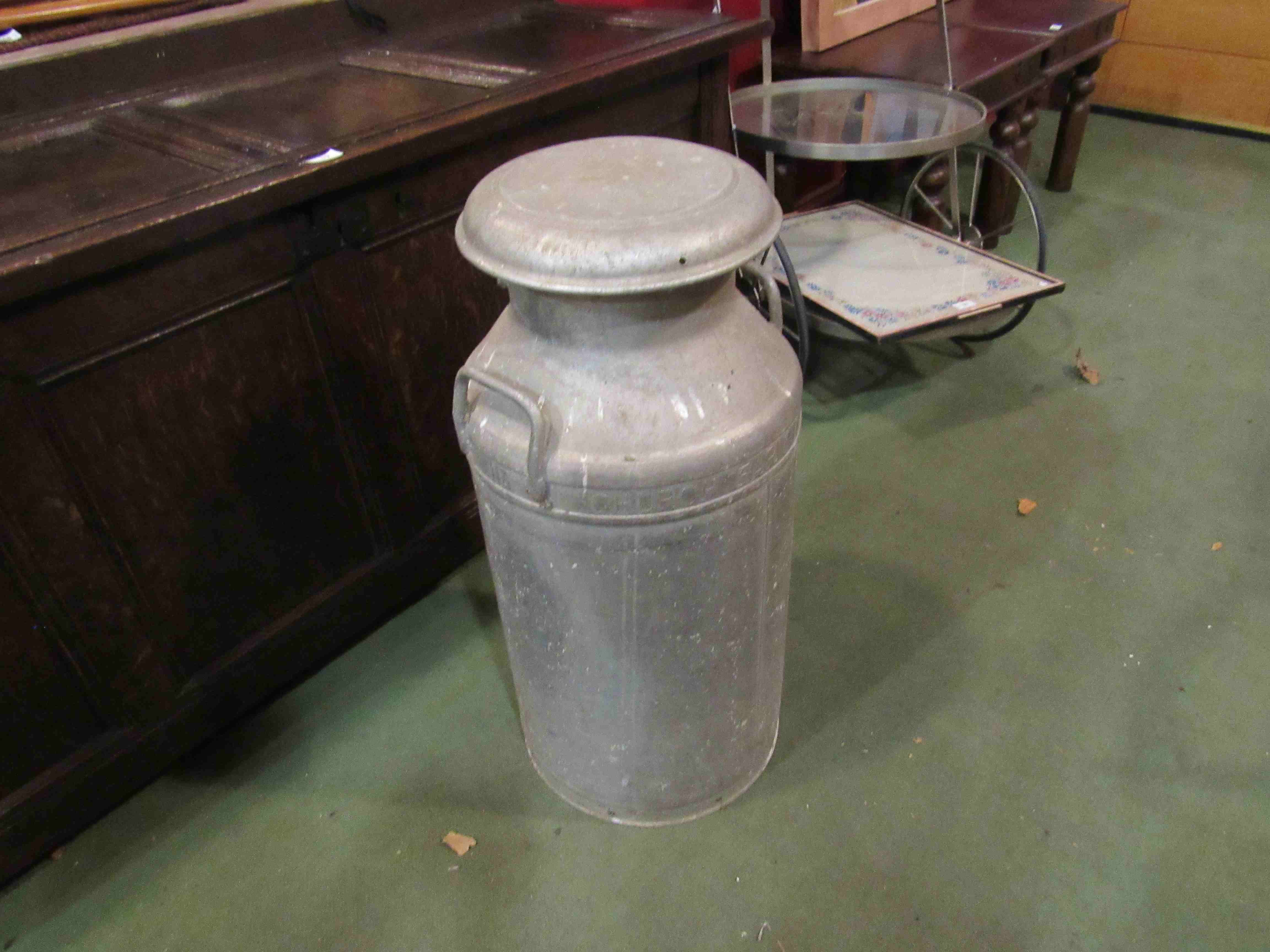 An aluminium milk churn