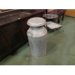 An aluminium milk churn