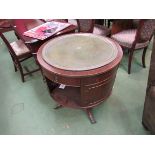 A reproduction drum table with insert tooled leather top,