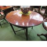 An Edwardian Pembroke table with carved border/edge, square tapering legs, filled cracks to top,