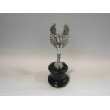 A reproduction winged Icarus car mascot,