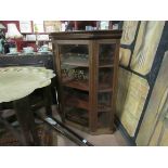 An Edwardian mahogany counter top display cabinet with painted advertising glass panels,