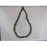 A green jade bead necklace,