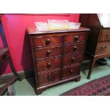 A 19th Century crossbanded mahogany two door cabinet of faux drawers with brass carrying handles