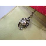 A white gold pendant/brooch set with single pearl, 8mm, unmarked 3.5cm drop, hung on chain, 5.