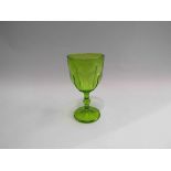 A green vaseline glass goblet,