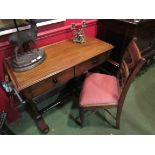 A Victorian two drawer lady's desk and a chair (2)