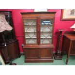A 1930's Regency style mahogany glazed bookcase,