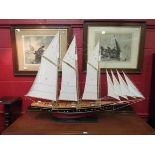 A scratch built model of a boat on stand,