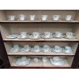 A collection of Shelley tea and coffee wares, sugar bowls, milk jugs and two plates,