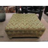 A 19th Century needlepoint square footstool on spherical gilt metal feet,