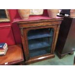 A 19th Century mahogany and walnut pier cabinet with glazed door, some brass beading missing,