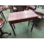 A 1920's oak side table with barley-twist supports,