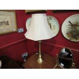 A pair of brushed brassed table lamps with shades,