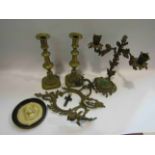 A pair of brass candlesticks, ornate candelabrum,