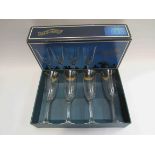 Four lead glass champagne glasses,