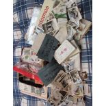 A good quantity of assorted postcards and cigarette cards,