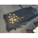 A small black piano shawl with floral embroidery