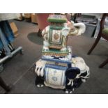 Two ceramic elephant jardiniere stands