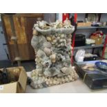 A Shell mounted grotto lamp,